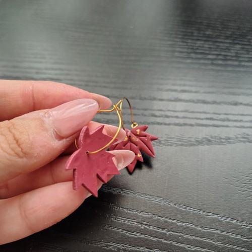 Red and gold leaf-shaped dangle earrings