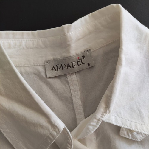White short sleeve utility shirt with contrast stitching and waist strap