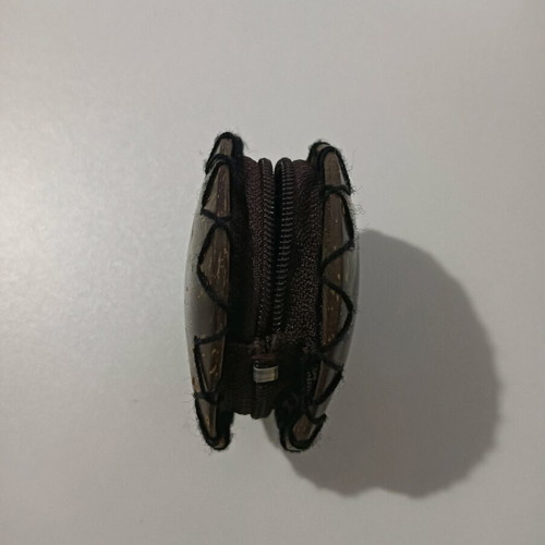 Small wallet used made of natural materials with zipper brown