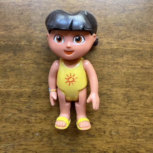 Dora the Explorer figure in yellow swimsuit used by Mattel and Viacom