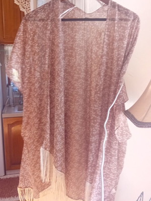Kimono with soft color and fringes