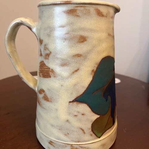 Handmade earthenware jug new with embossed floral pattern