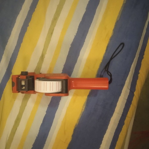 Handheld price machine used, red labeler