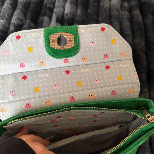 Green suede crossbody bag used with gold details