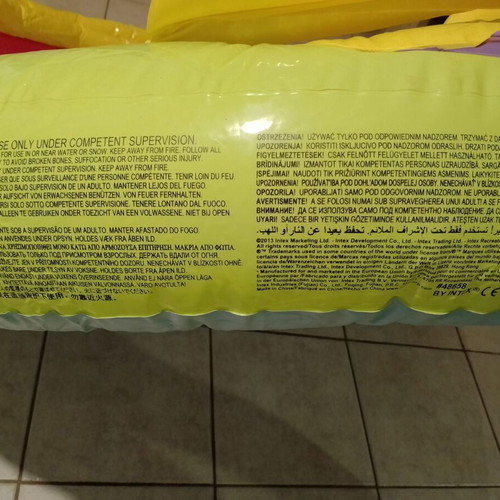Inflatable colorful playpen used with balls and slides