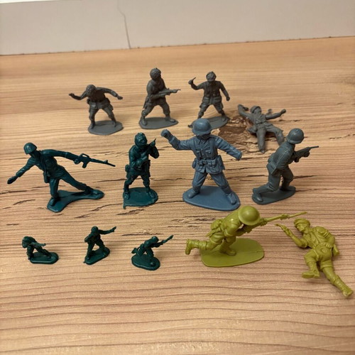 Vintage plastic military toys used with vehicles, flags and rockets