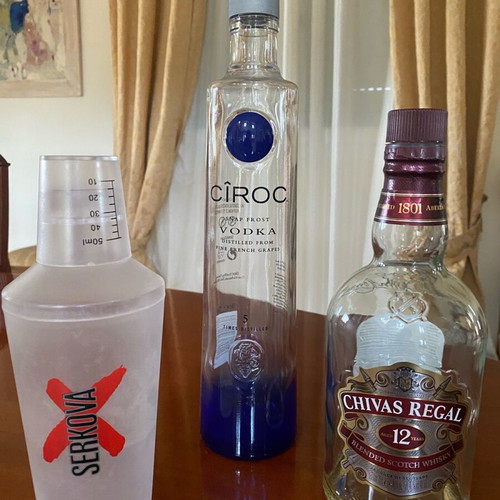 Empty premium liquor bottles and cocktail shaker like new