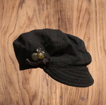 Black flat cap used with buttons