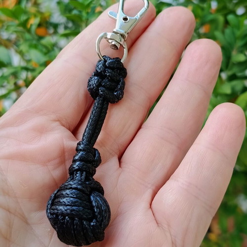 Handmade men's keychain with black leather cord and football ball