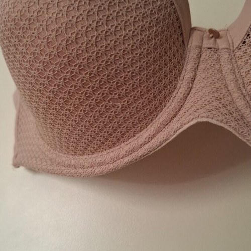 Beige bra new with small front tear