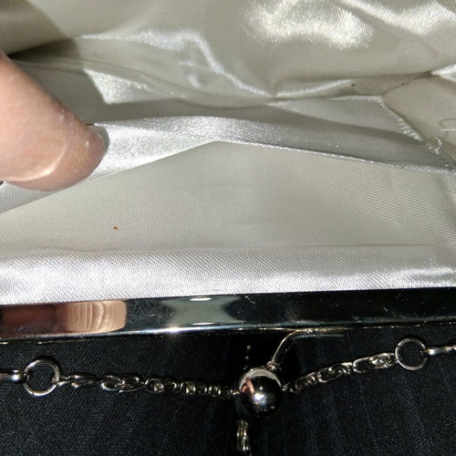 Small silver evening clutch bag used