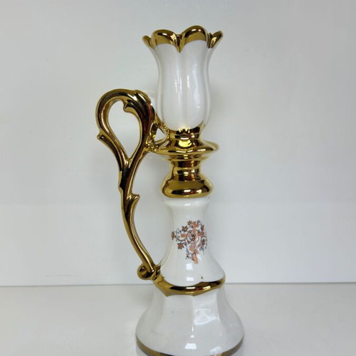 Ceramic candlestick with gold details and floral cross design