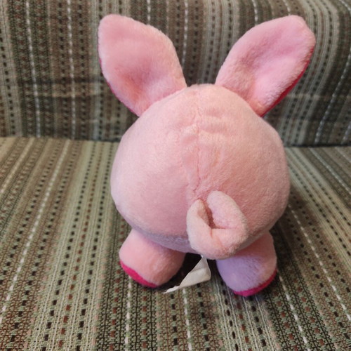 Plush pig used with velvet texture and curled tail