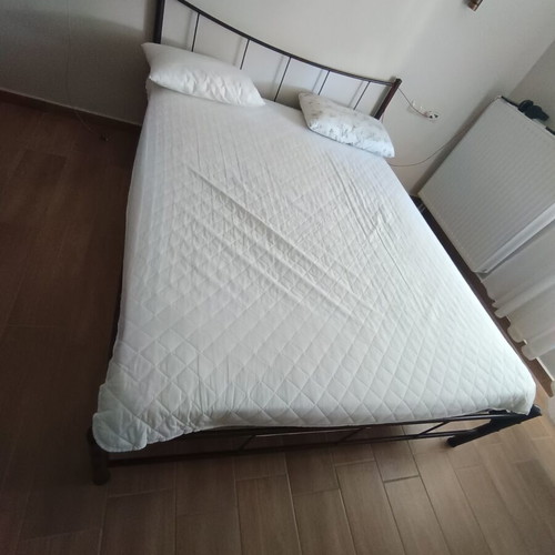 Iron double bed frame with slats and mattress