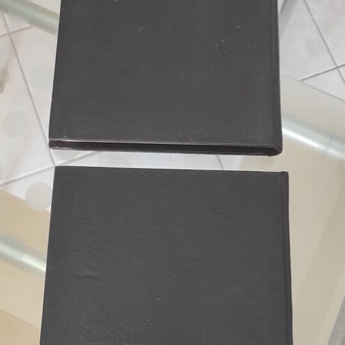 Two leather-bound classic novels, Greek