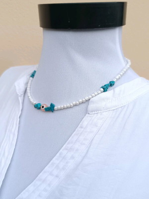Handmade white necklace with a pink eye and turquoise howlite