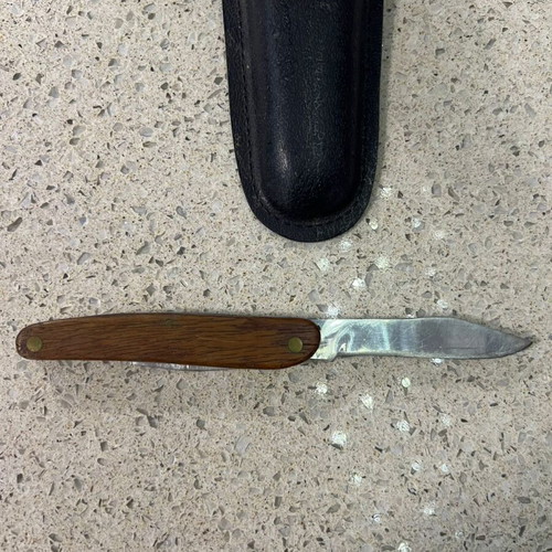 Folding knife used from 1980s with sheath