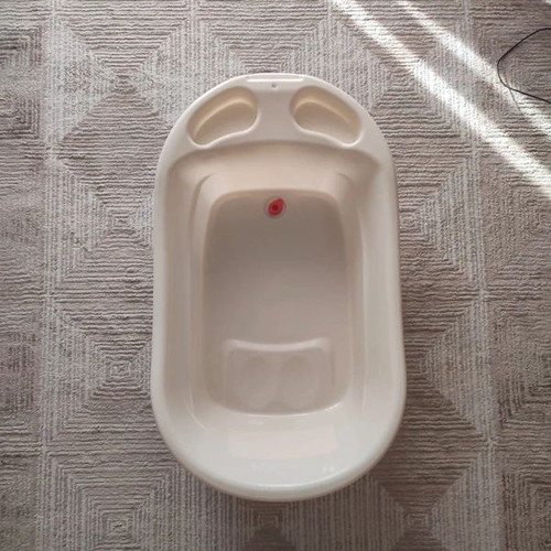 Baby Bathtub like new, beige with anti-slip surface and drain plug