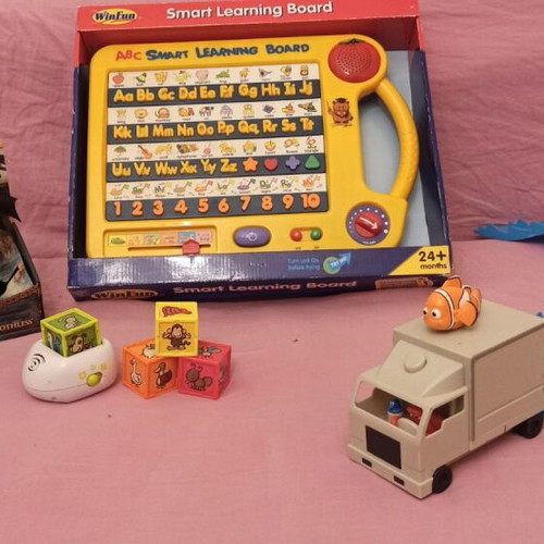 Educational toy set like new with learning board, dragon figure, animal cubes, and Nemo truck