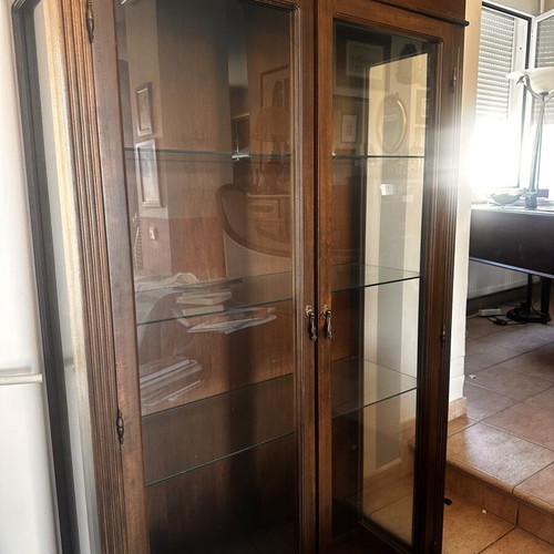 Wooden display cabinet with glass doors and shelves
