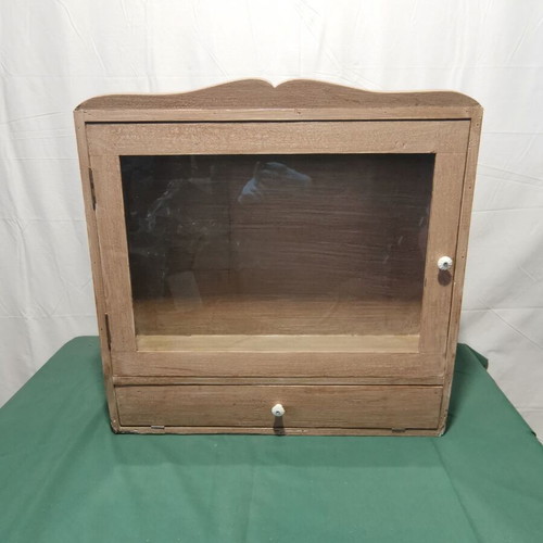 Hanging display cabinet used with glass and storage space, 1960