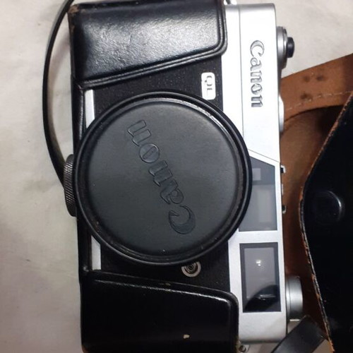 Canon Canonet QL19 camera used with flash and extra lens