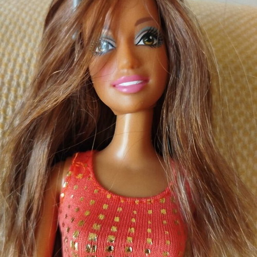 Barbie doll by Mattel like new with denim skirt and gold details