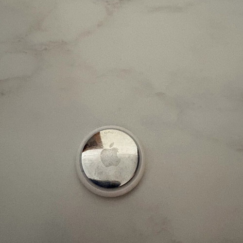 Apple AirTag 1st Gen used with ghost engraving and protectors