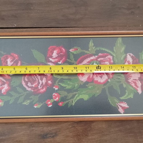 Vintage cross stitch picture of roses and poppies