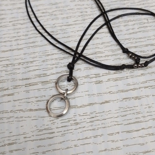 Men's black pendant with silver circles