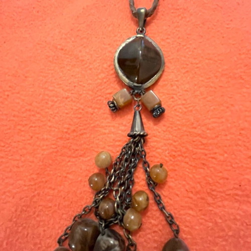 Necklace with leather strap and stones, modern design