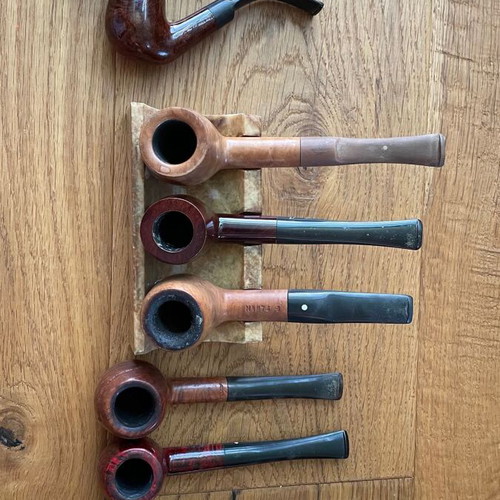 Smoking accessories like new, pipes, stands, pouches and cleaning tools