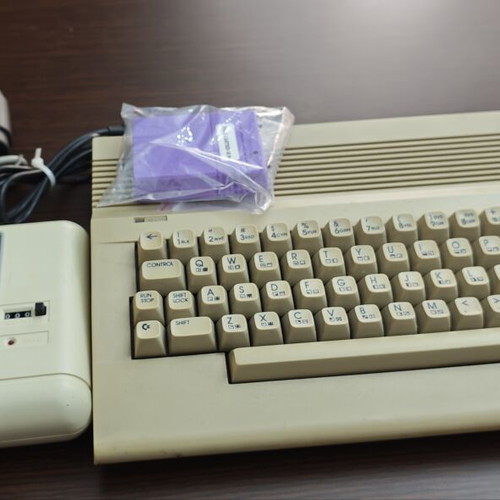 Commodore C64c personal computer with joystick and accessories