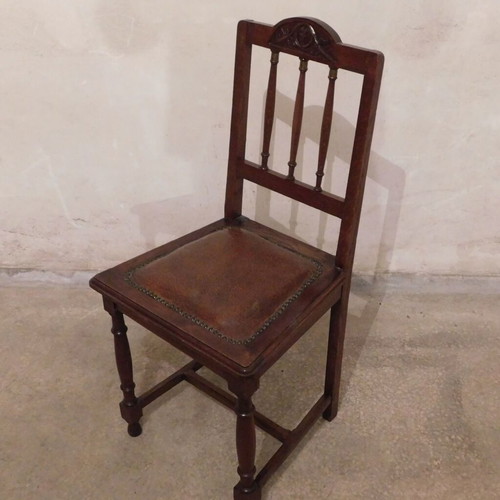 Wood-carved chairs with leather seat like new, set of 4