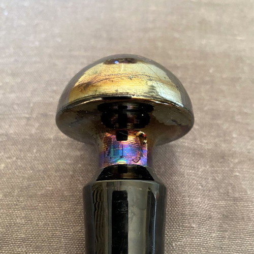 Vintage glass bottle with metal stopper and dried flowers used