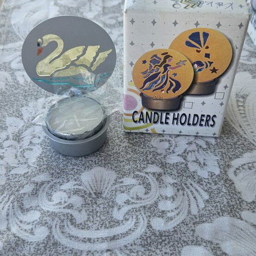 Metal candle holder with stained glass design