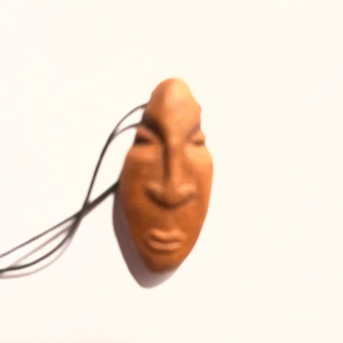 Clay face necklace like new, beige