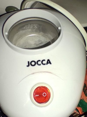 Electric wax warmer used for home hair removal