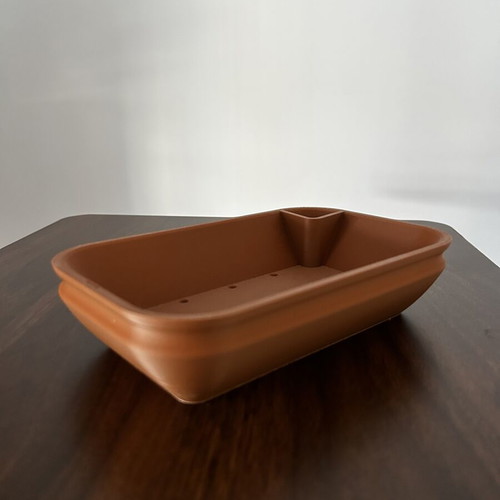 Plastic planter like new with automatic watering feature, size 12x20x5 cm