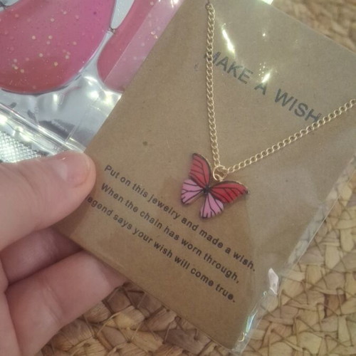 Butterfly necklace new with gold chain and pink eye patches