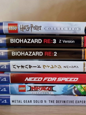 PS4 games pack of 7 used, 2 sealed (RE2 and Village)