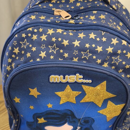 Must school backpack like new with three compartments and bottle holder