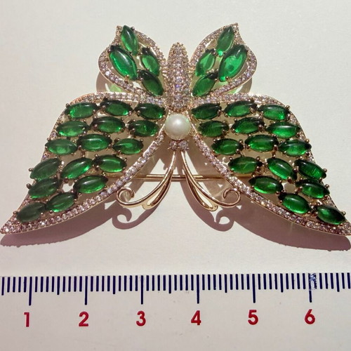 Vintage butterfly brooch with green cabochon stones and white zircon, like new