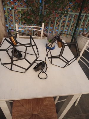 Two rhombic metal ceiling lights