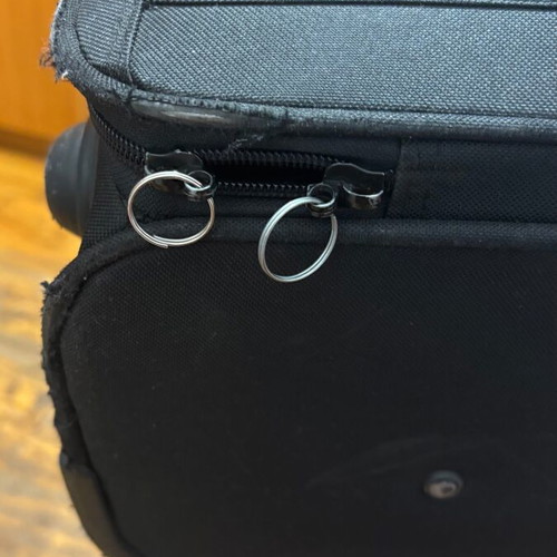 Benetton fabric black suitcase used with two wheels