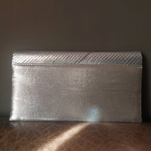 Vintage silver envelope hand bag like new with strap