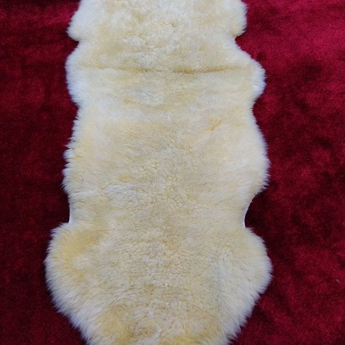 Sheepskin rug new, champagne color 2.05x0.75