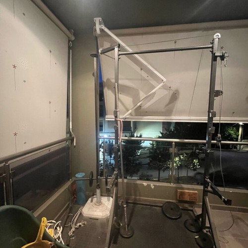 Training rack with barbell and pulley system