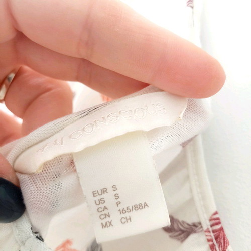 H&M strap top like new, white with feather print