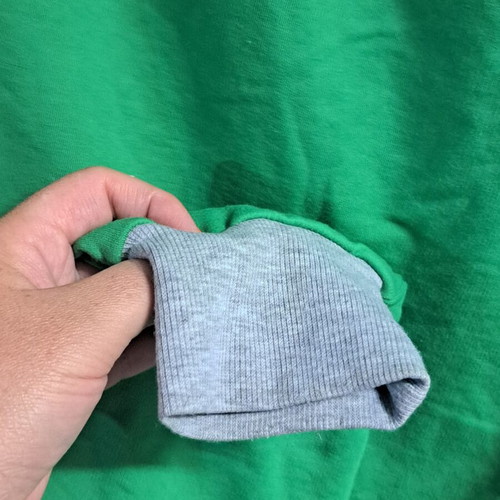 Two-tone sweatpants used, gray and green with metallic buttons, size XL